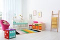 Colorful baby room interior with crib