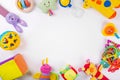 Colorful baby toys on white with copy space