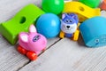 Colorful baby toys, on white wooden floor in baby room Royalty Free Stock Photo