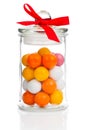 Colorful background of assorted Gumballs in glass jar