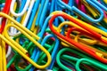 colorful background with bright colors created with plastic-coated metal paper clips.