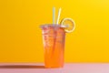 A colorful background complements a zesty lemonade cocktail in a plastic cup Royalty Free Stock Photo