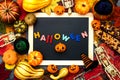 colorful background is decorated with leaves, pumpkins and skeletons.autumn holiday Halloween. Inscription HALLOWEEN. Place for