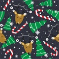 Colorful seamless pattern with deers, fir trees, candy canes, snow. Decorative cute background with animals. Happy New Year Royalty Free Stock Photo