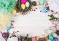 Colorful background with Easter eggs on white wooden board background. Happy Easter concept. Can be used as poster, background,