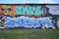 Colorful background of graffiti painting artwork with bright aerosol outlines on wall. Old school street art piece made Royalty Free Stock Photo