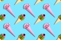 Colorful background from paper waffle cones with flowers and desserts