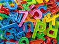 Colorful Background of Plastic Numbers with English and Thai Alphabets Royalty Free Stock Photo