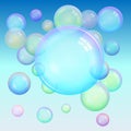 Colorful background of realistic transparent colorful soap bubbles with a rainbow reflection on a blue background Royalty Free Stock Photo