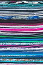 Colorful background striped pattern of overlocked binding on carpets or textile in the colours of the rainbow showing