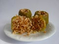 Colorful baked with yoghurt, stuffed peppers with rice and minced meat. Front view. Royalty Free Stock Photo