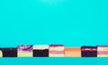 Colorful bakery slice on blue background.Food and healthy concepts