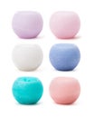 Colorful ball-shaped candles over white