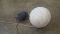 Colorful ball of threads wool yarn for knitting on grey floor background Royalty Free Stock Photo