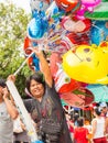 Colorful ballon vendor in Tak Bat Devo Festival, Uthaithani, Thailand 2013 Royalty Free Stock Photo