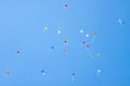 Colorful ballons with letters flying in the blue sky Royalty Free Stock Photo