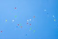 Colorful ballons with letters flying in the blue sky Royalty Free Stock Photo