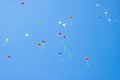 Colorful ballons with letters flying in the blue sky Royalty Free Stock Photo