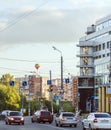 Colorful balloon over summer city streets