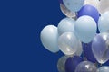 Colorful balloons on blue background. happy new year and happy birthday concept