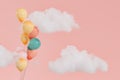 colorful balloons among clouds on a pastel pink background Royalty Free Stock Photo