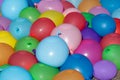 Colorful balloons are filled with water. Prepared for water combat to be thrown. Props for a summer party and children`s Royalty Free Stock Photo