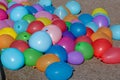 Colorful balloons are filled with water. Prepared for water combat to be thrown. Props for a summer party and children`s party. Royalty Free Stock Photo