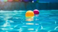 Colorful balloons floating in a swimming pool with shallow depth of field