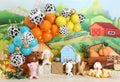 Colorful balloons, hay, farm animals with lights, personalized 1st birthday farm decor