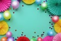 Colorful balloons and paper flowers on blue table top view. Festive or party background. Flat lay style. Copy space for text. Birt Royalty Free Stock Photo