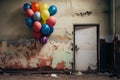 Colorful balloons in a room with old damaged wall and door.