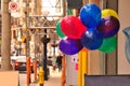 Colorful balloons on urban street Royalty Free Stock Photo