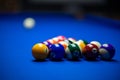 Colorful balls on a blue pool table. Set up and ready to play. Selective focus Royalty Free Stock Photo