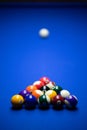 Colorful balls on a blue pool table. Set up and ready to play. Selective focus Royalty Free Stock Photo