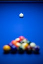 Colorful balls on a blue pool table. Set up and ready to play. Selective focus Royalty Free Stock Photo