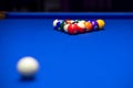 Colorful balls on a blue pool table. Set up and ready to play. Selective focus Royalty Free Stock Photo