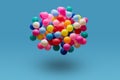 Colorful balls levitation in mid air on blue background Royalty Free Stock Photo