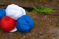 Colorful balls of wool and cotton yarn on the rustic background Royalty Free Stock Photo