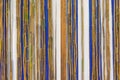 Colorful bamboo fence on wood texture for background Royalty Free Stock Photo