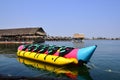 Colorful banana boat floating on the water Royalty Free Stock Photo