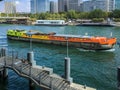 Colorful barge passes 13th arrondissement on the Seine River, Paris, France Royalty Free Stock Photo