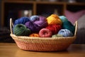 colorful basket of knitting supplies, with cozy throw nearby