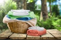 Laundry Basket with colorful towels on background Royalty Free Stock Photo