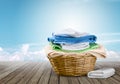 Laundry Basket with colorful towels on background Royalty Free Stock Photo