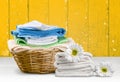 Laundry Basket with colorful towels on background Royalty Free Stock Photo