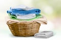 Laundry Basket with colorful towels on background Royalty Free Stock Photo