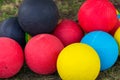Colorful basketballs balls on green field close up Royalty Free Stock Photo
