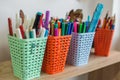 Colorful Baskets of Markers and Pens in Classroom Royalty Free Stock Photo