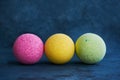 Colorful bath bombs on blue background. Copy space for text