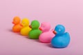 Colorful rubber ducks on pink background Royalty Free Stock Photo
